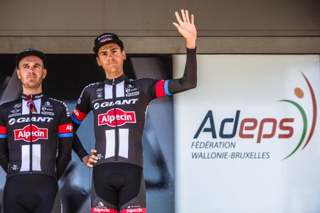 Warren Barguil (Giant-Alpecin) waves from the podium