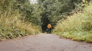 Father and son walking down country lane