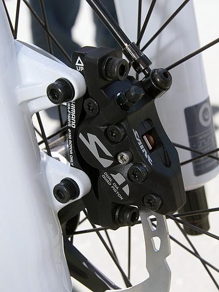 Shimano sticks with the two-piece caliper on the new Saint for a stiffer body.