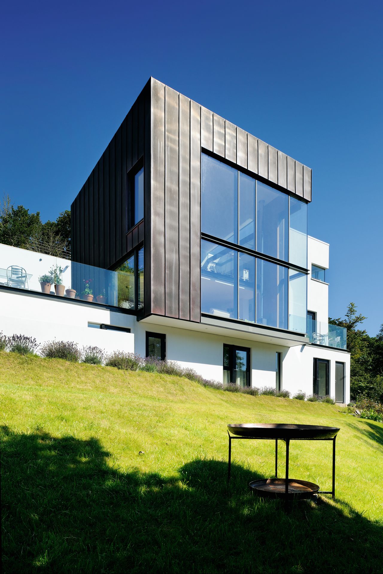 modernist self build house build on sloping hillside
