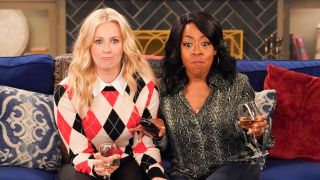 Gemma and Tina drinking wine on the couch in CBS' The Neighborhood Season 8x09