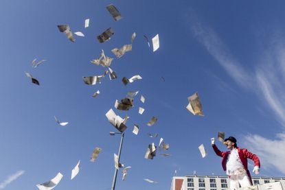 An activist protests economic inequality in Berlin.