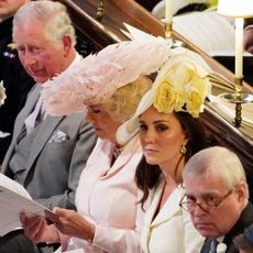 King Charles, Queen Camilla, Kate Middleton and Prince Andrew sit together at Meghan Markle and Prince Harry's wedding in May 2018