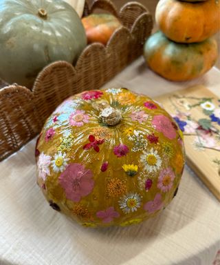 pumpkin decorated with pressed flowers