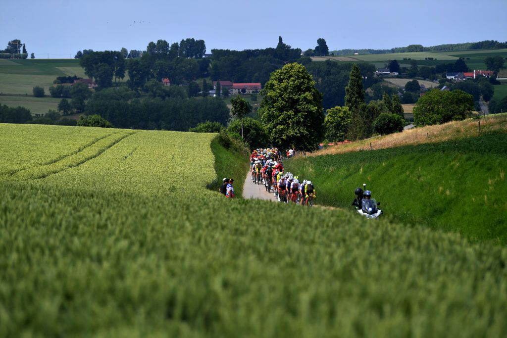 MAARKEDAL BELGIUM JUNE 15 A general view of the peloton competing during the 91st Baloise Belgium Tour 2022 Stage 1 a 165km stage from Merelbeke to Merelbeke BaloiseBelgiumTour on June 15 2022 in Maarkedal Belgium Photo by Luc ClaessenGetty Images