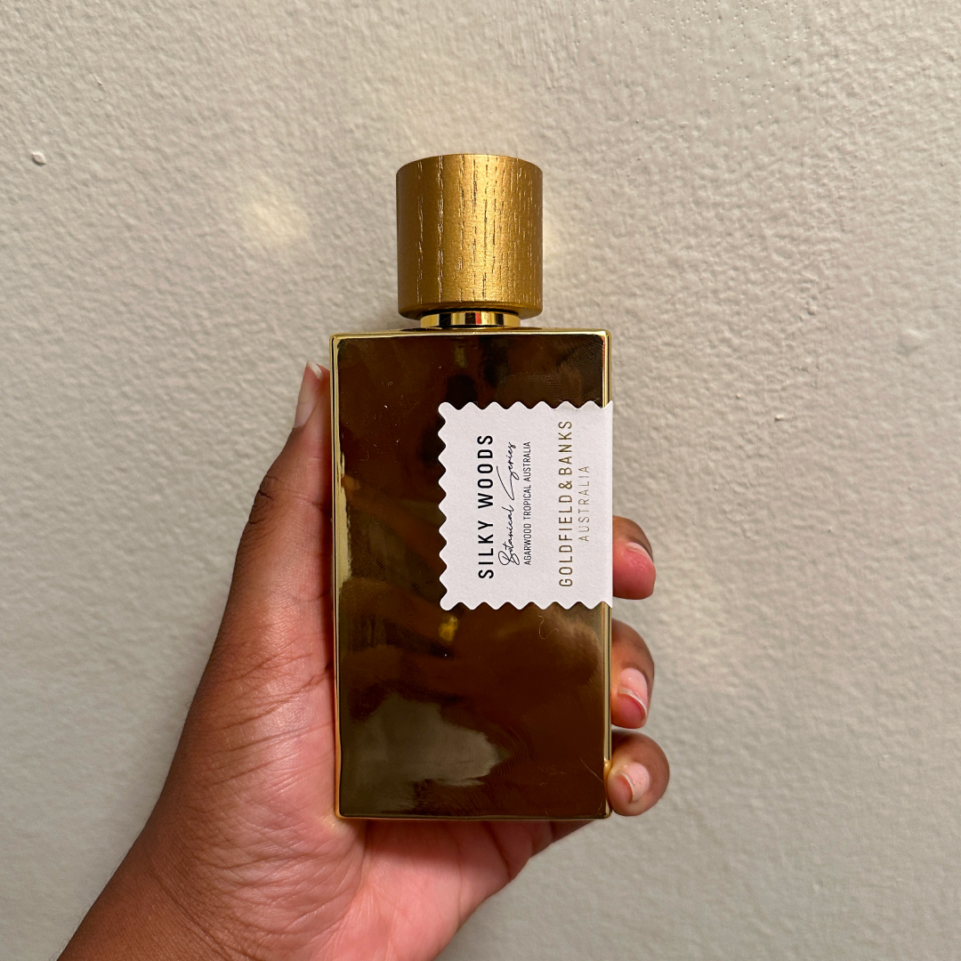 Ariel Baker holding Silky Woods Eau de Parfum