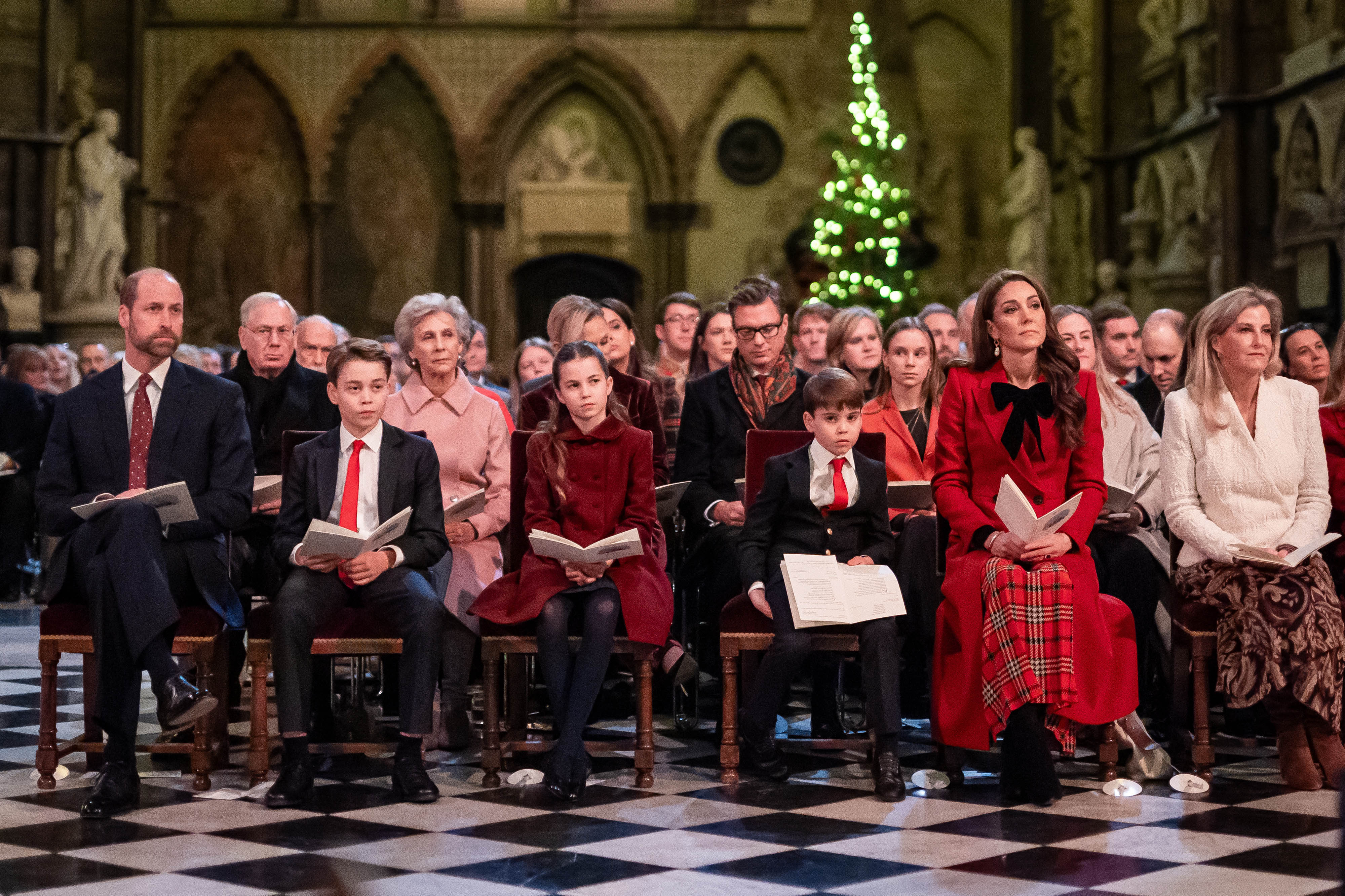 Prince William, Prince George, Princess Charlotte, Prince Louis, Princess Kate and Duchess Sophie sitting at the Together at Christmas carol concert
