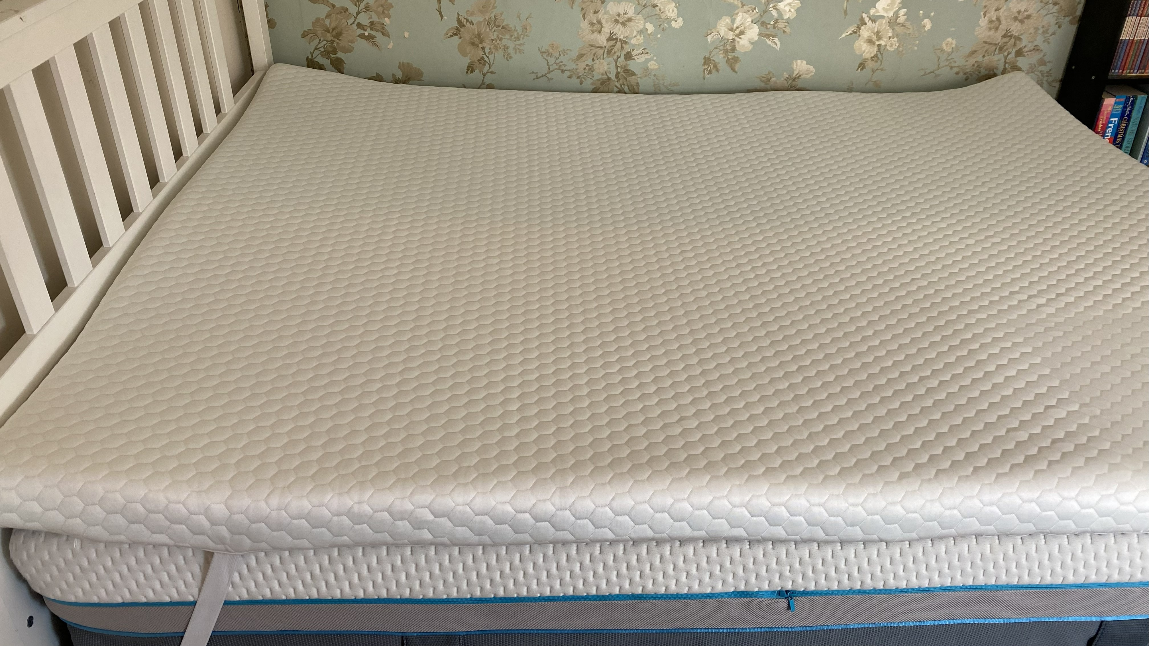Our tester's queen-size Helix Dual Comfort Mattress Topper on her bed that she shares with her partner.