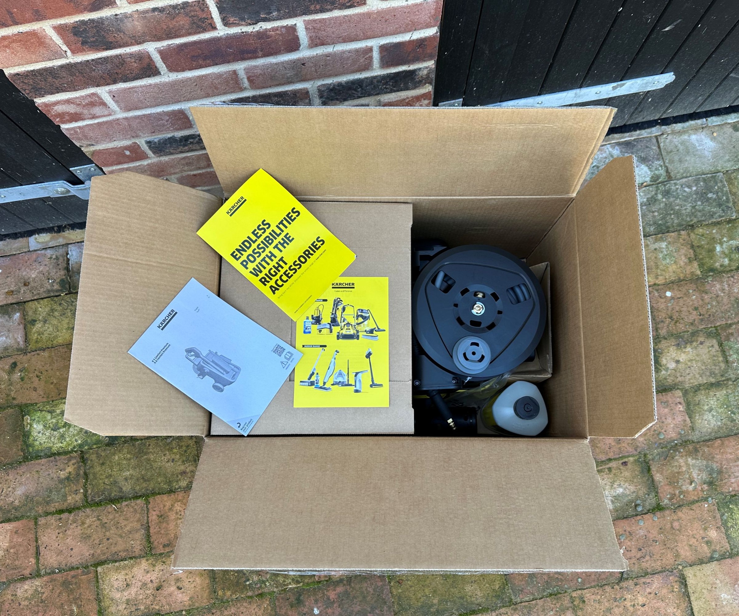 A yellow K&auml;rcher K5 comfort premium pressure washer after unboxing and assembling
