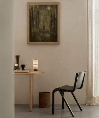 A small table and chair in a Japandi-style space