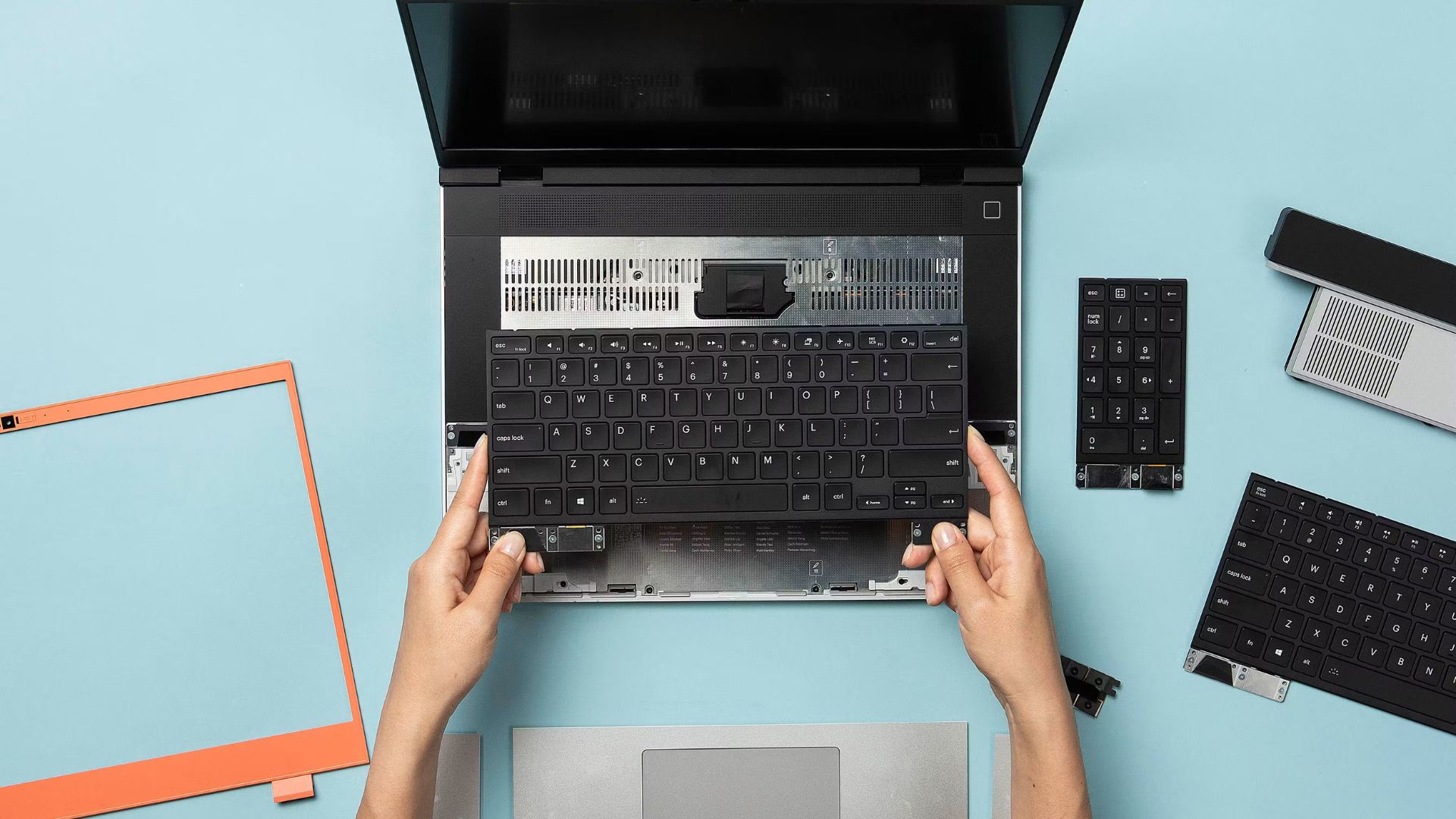 A Framework image showing one of the brand's laptop keyboards being attached to its chassis