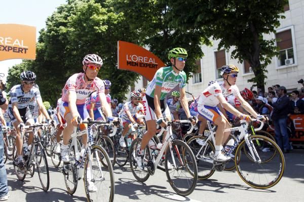 The riders roll out from the start