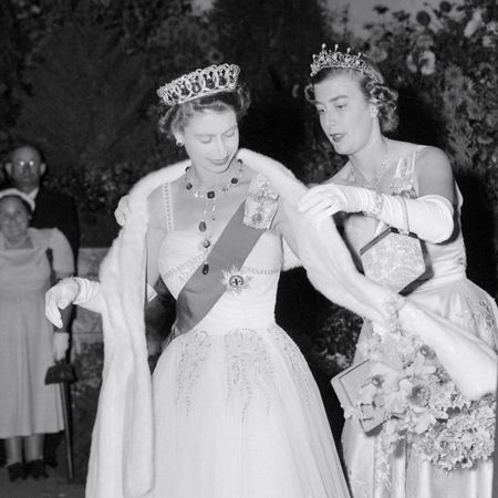 Lady Pamela Hicks helping Queen Elizabeth with her shawl