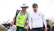 Nick Taylor walks with his caddie during the 2024 WM Phoenix Open