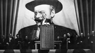 harles Foster Kane (Orson Welles) makes a stirring campaign speech before a larger-than-life portrait of himself in a scene from Citizen Kane