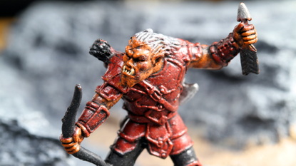 Vancouver, Canada - January 15, 2012: A hobgoblin archer from the Wizards of the Coast tabletop Dungeons and Dragons game, posed on a rocky background.