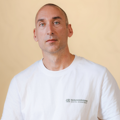 An upper-body shot of Bence Pajor looking directly ahead.