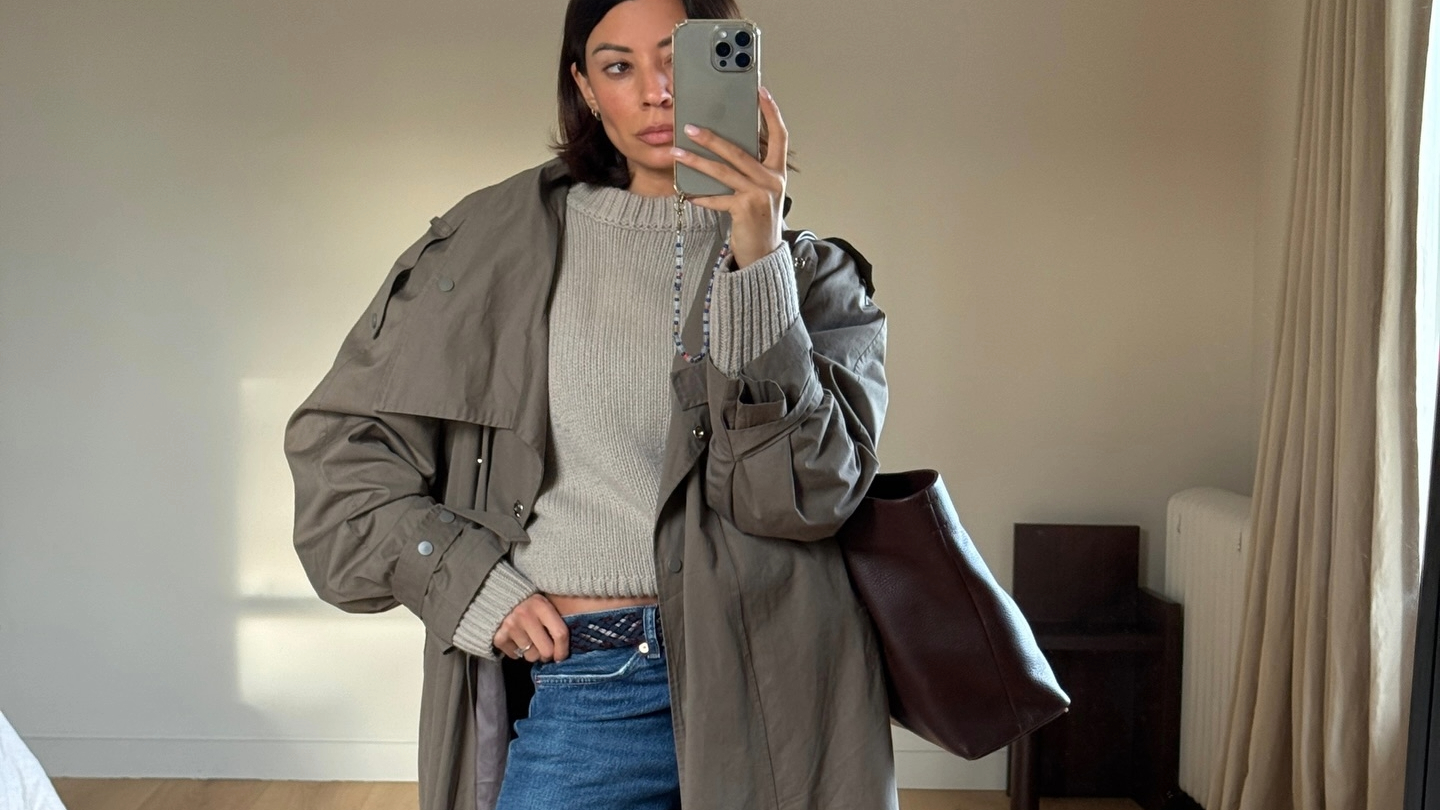 Marianne Smyth in a trench coat and jeans