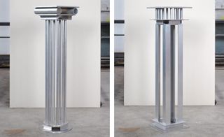 Two metal columns inspired by Roman architecture