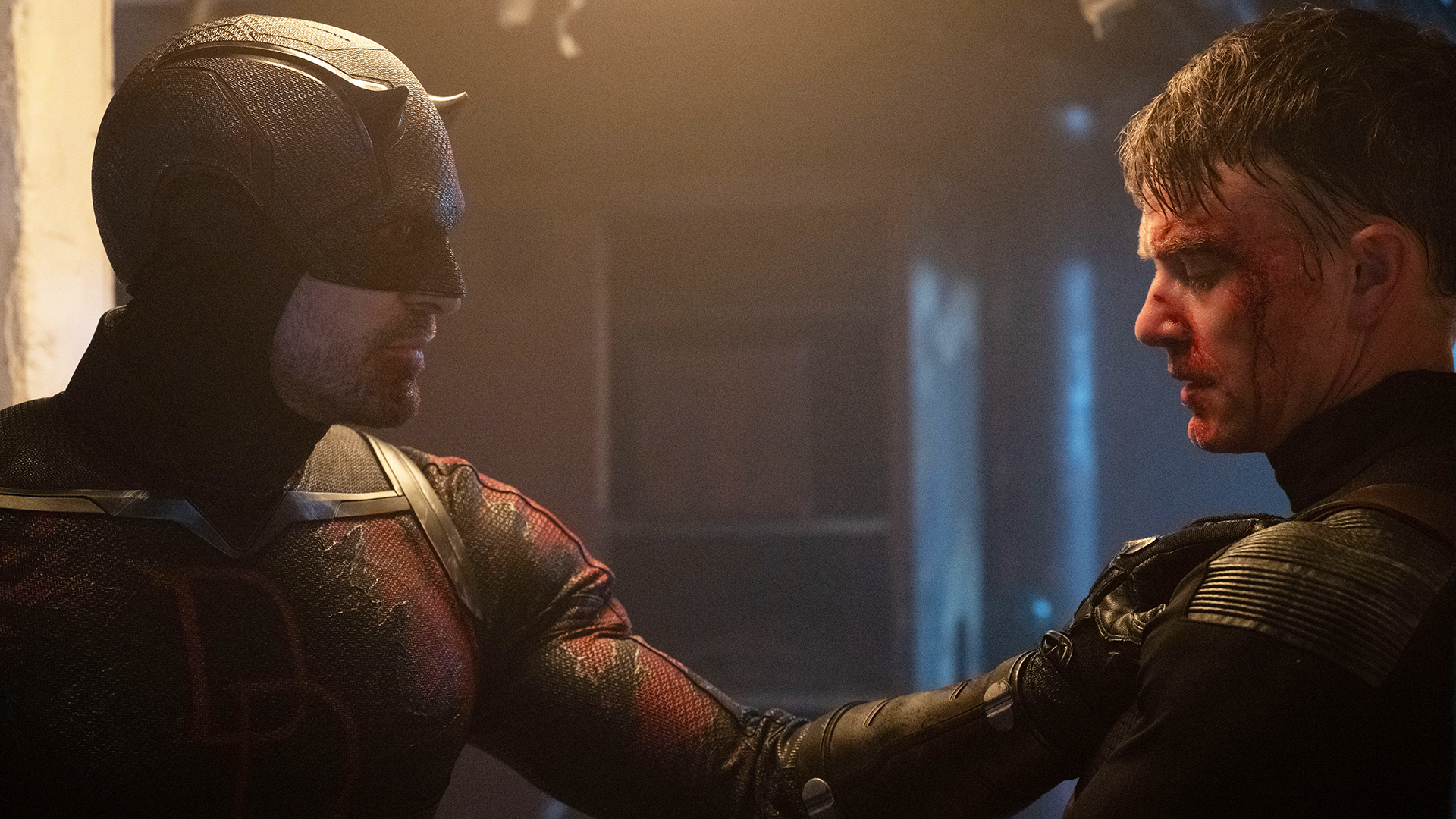 A costumed Matt Murdock holding up Bullseye in a corridor in Daredevil: Born Again season 2 episode 5