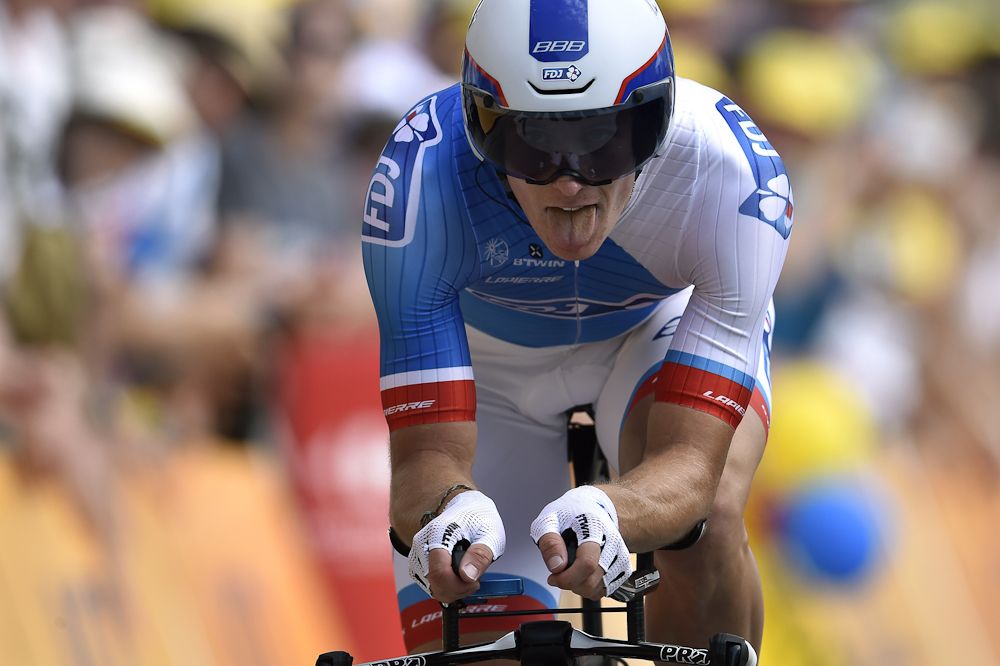 Arnaud Demare crosses the finish line at the end of a 13.8 km stage 1 individual time trial