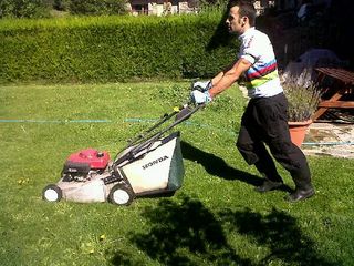 Jose Antonio Hermida demonstrates that even World Champions still have to mow the grass.