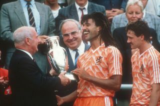 Netherlands captain Ruud Gullit receives the trophy after victory at Euro 88