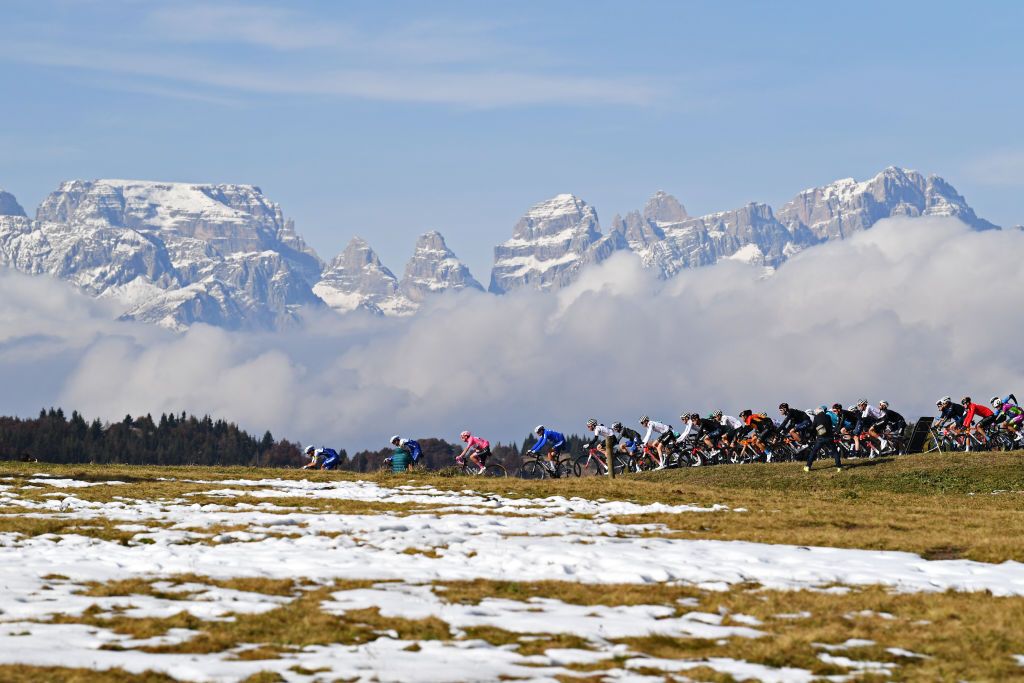 MADONNA DI CAMPIGLIO ITALY OCTOBER 21 Davide Ballerini of Italy and Team Deceuninck QuickStep Joao Almeida of Portugal and Team Deceuninck QuickStep Pink Leader Jersey Fausto Masnada of Italy and Team Deceuninck QuickStep Sam Oomen of The Netherlands and Team Sunweb Chad Haga of The United States and Team Sunweb Wilco Kelderman of The Netherlands and Team Sunweb Monte Bondone 1575m Dolomites Southern Limestone Alps Peloton Snow Landscape Mountains during the 103rd Giro dItalia 2020 Stage 17 a 203km stage from Bassano del Grappa to Madonna di Campiglio 1514m girodiitalia Giro on October 21 2020 in Madonna di Campiglio Italy Photo by Tim de WaeleGetty Images