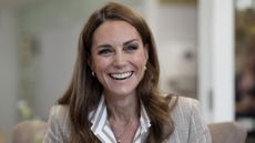 Catherine, Princess of Wales smiles during a visit to see the RHS Wellbeing Garden at Colchester Hospital in Essex, southeast England on July 2, 2025
