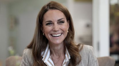Catherine, Princess of Wales smiles during a visit to see the RHS Wellbeing Garden at Colchester Hospital in Essex, southeast England on July 2, 2025