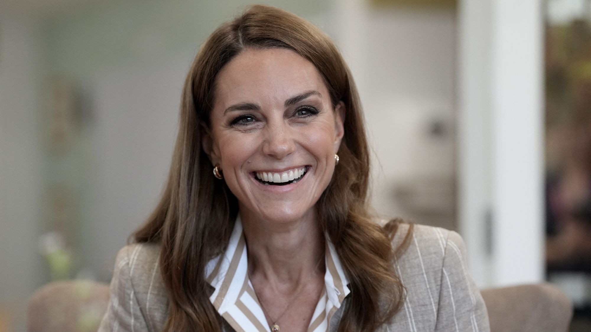 Catherine, Princess of Wales smiles during a visit to see the RHS Wellbeing Garden at Colchester Hospital in Essex, southeast England on July 2, 2025