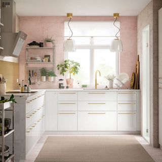 kitchen with pink wall white counter sink and chimney