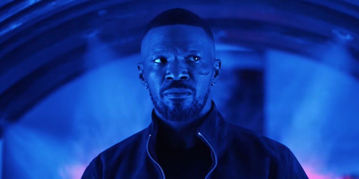 Project Power Jamie Foxx walking in a blue room