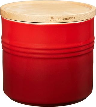 A red Le Creuset coffee canister