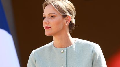 Princess Charlene of Monaco is seen as french President Emmanuel Macron and his wife Brigitte Macron are welcomed upon their arrival for a two-day state visit at the Prince Albert II of Monaco Palace ahead of the Unoc3 on June 7, 2025