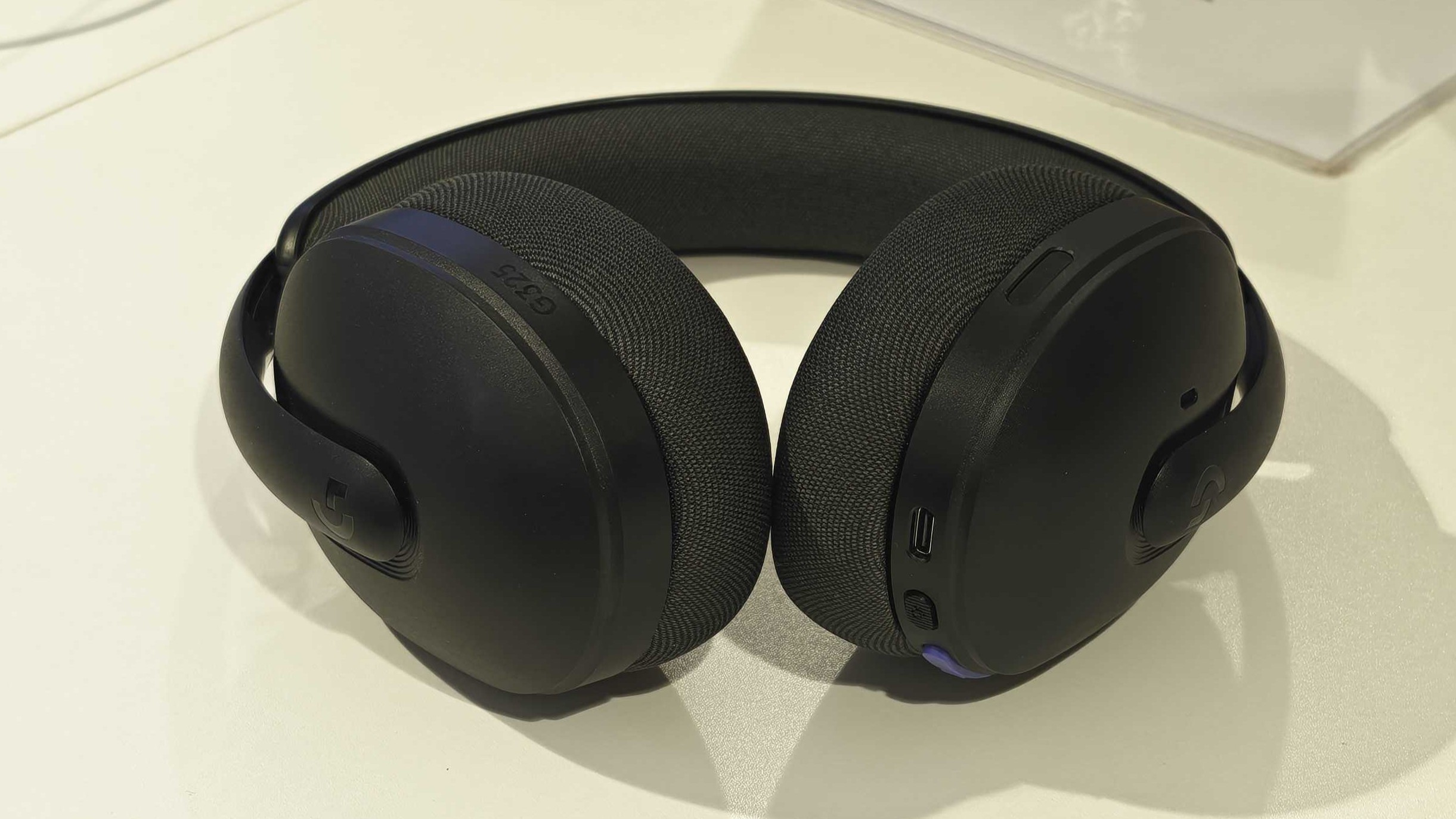 The Logitech G325 Lightspeed on a white table.