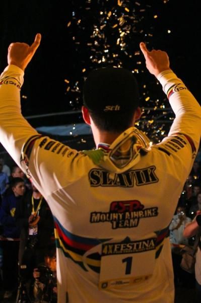 Tomas Slavik celebrates on the podium