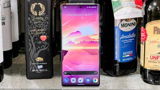 pixel 6 pro display on leaning against bottles