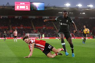 Tyler Dibling of Southampton under pressure from Ibrahima Konate of Liverpool during the Premier League match between Southampton FC and Liverpool FC at St Mary's Stadium on November 24, 2024 in Southampton, England.