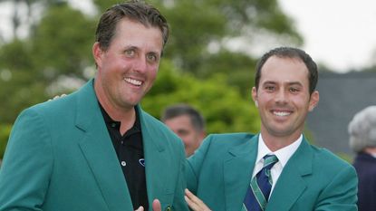 Phil Mickelson receives the Green Jacket from Mike Weir in 2004