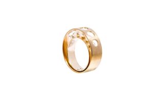 A larger gold ring with inset smaller gold ring. The two rings are joined at the bottom and are separated at the top by precious stones