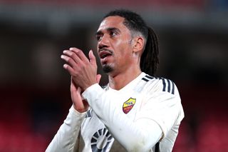 Chris Smalling applauds the Roma fans after a game against Monza in March 2024.