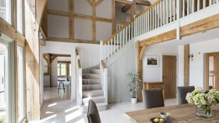oak frame dining rom and hallway with staircase and landing