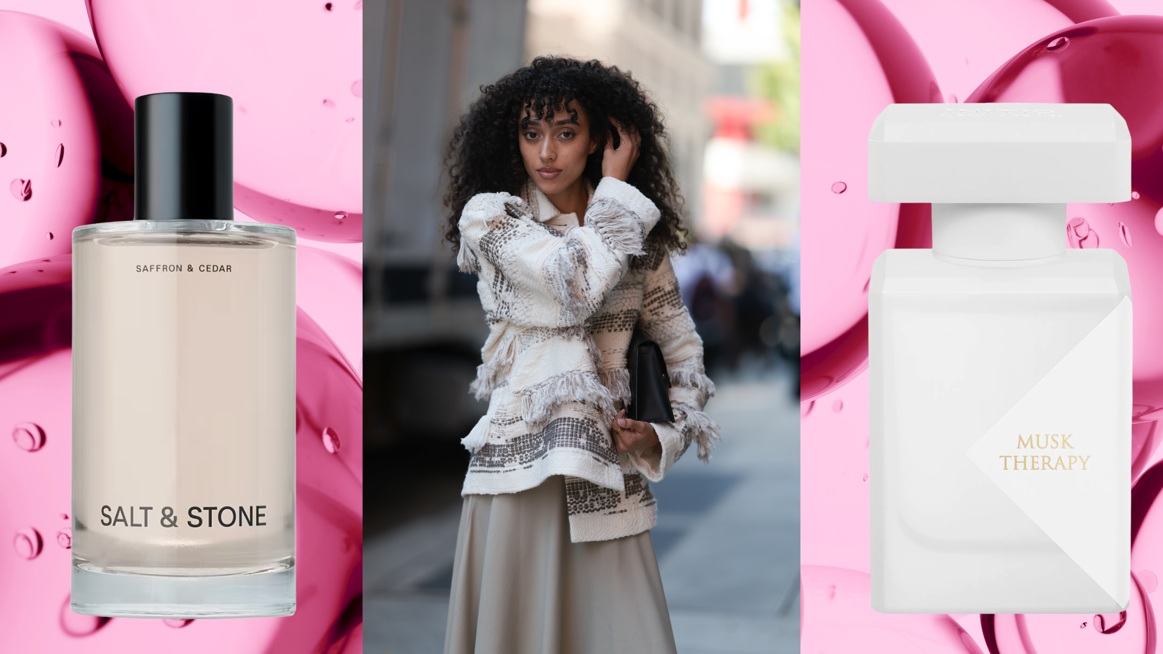A woman with curly hair wearing a ruffle top, holding a clutch with two bottles of hair perfume on her left and right. 
