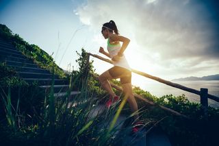 An athlete running up stairs.