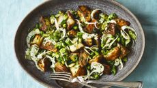 Kartoffelsalat on plate with fork and spoon