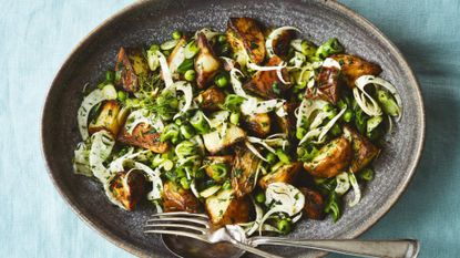 Kartoffelsalat on plate with fork and spoon