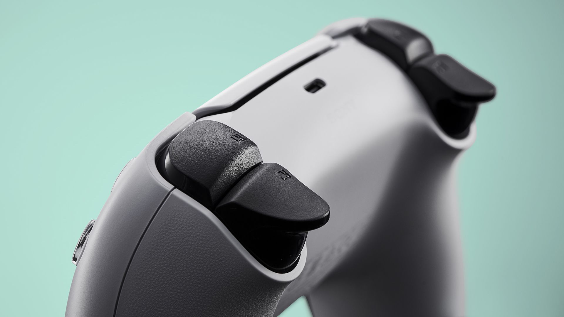 The PlayStation 5 DualSense controller with power port clearly shown.