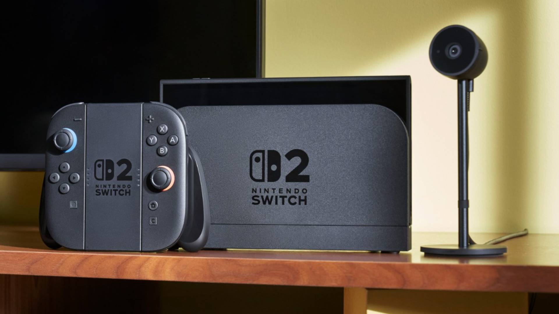 Docked Nintendo Switch 2 next to JoyCon controller and Camera.