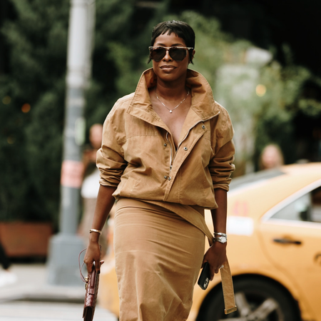 woman wearing all tan and sunglasses in new york city